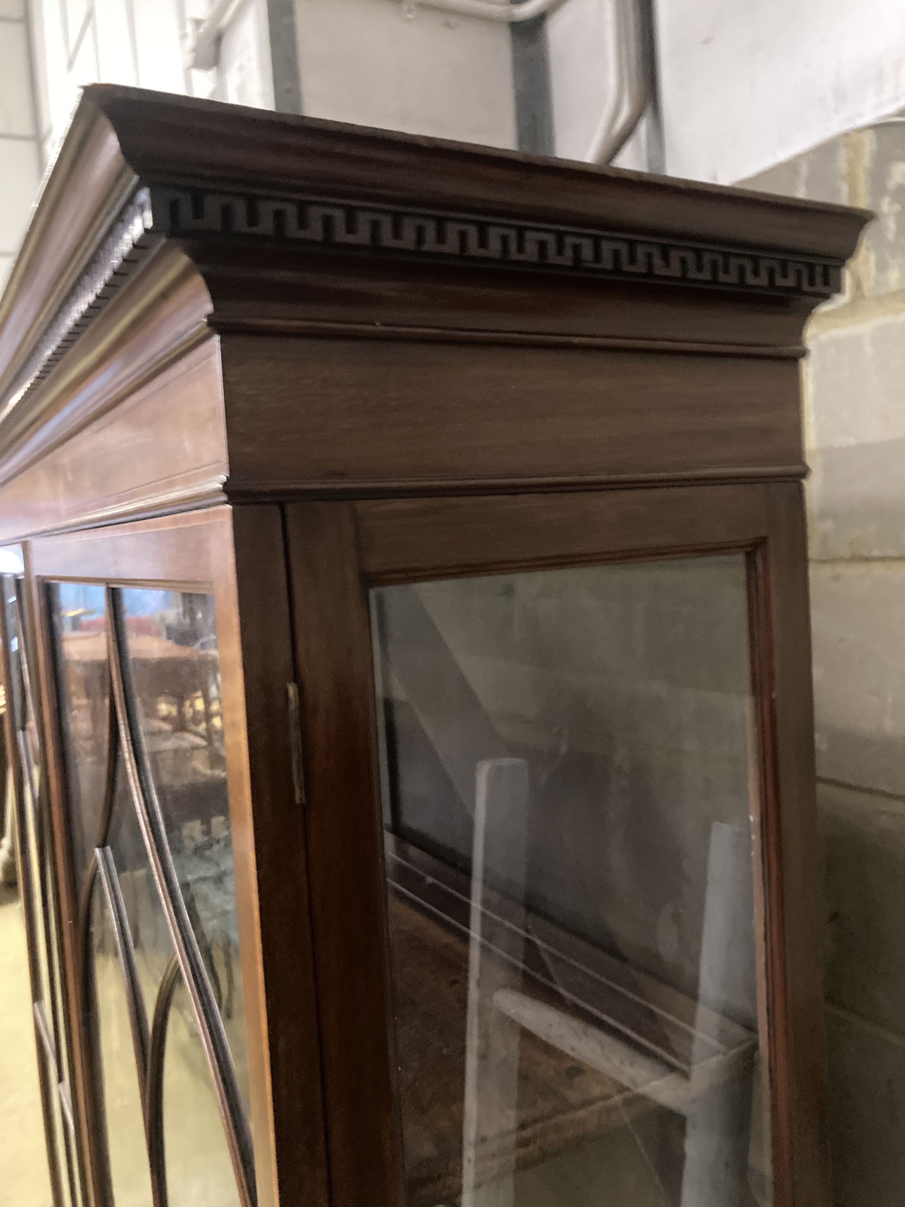 An Edwardian satinwood banded mahogany two door display cabinet, width 126cm, depth 39cm, height 204cm